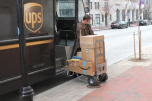 UPS driver unloading packages from the truck
