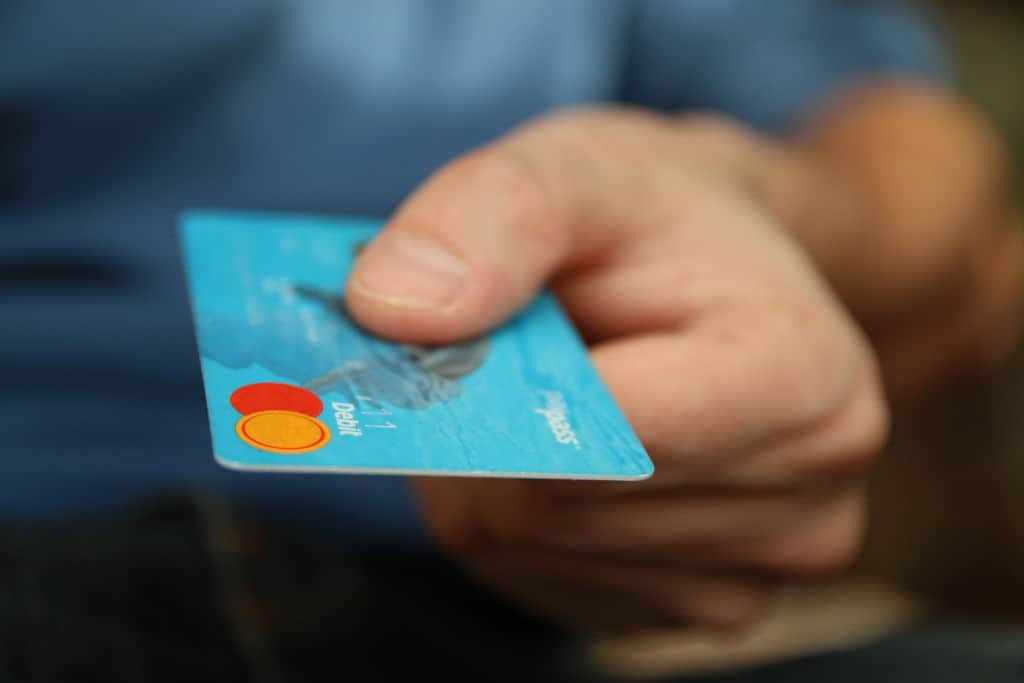 debit card in hands of a man