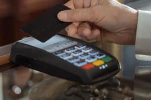 holding a card for transaction payment